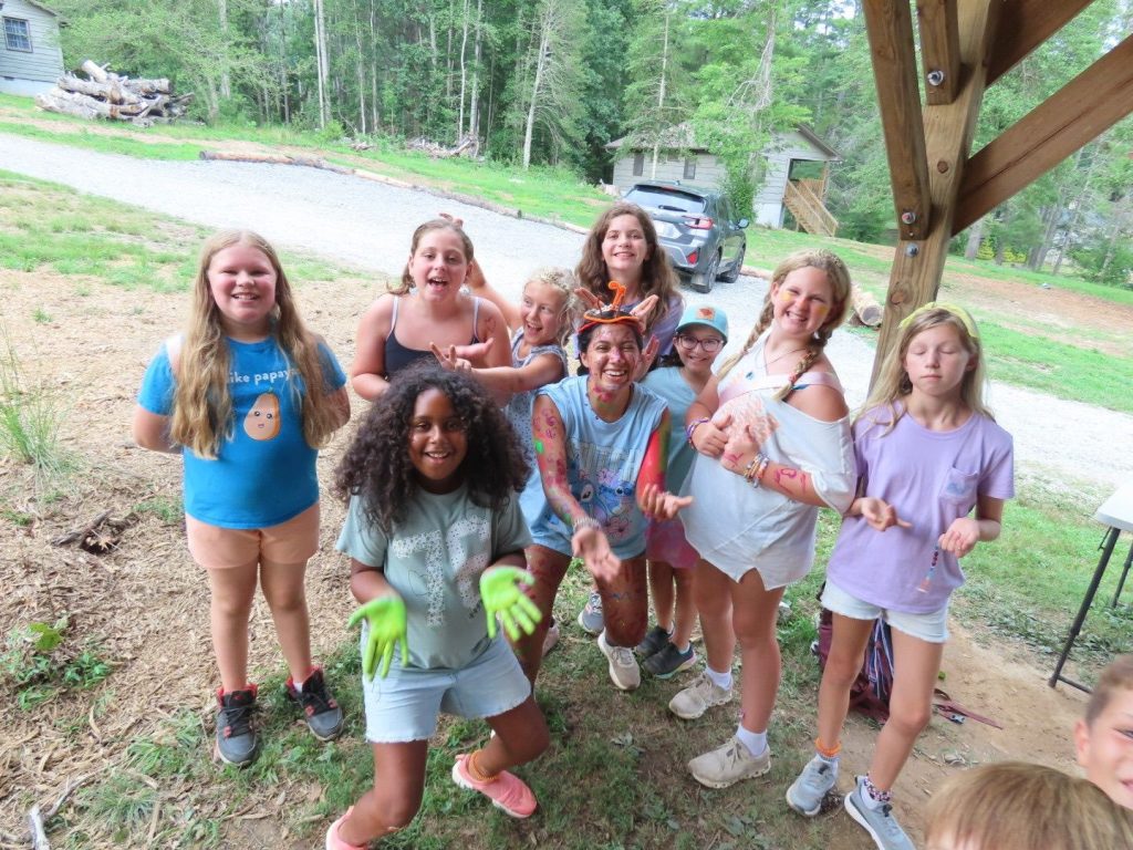 Campers cheering together outside the pavilion at Lutheridge