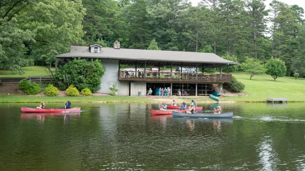 Lakeside Lodge across the lake, with canoes on the water