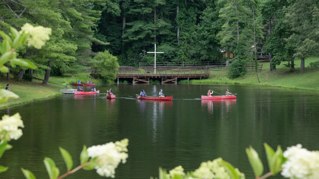 Canoes on the lake by the lakeside cross
