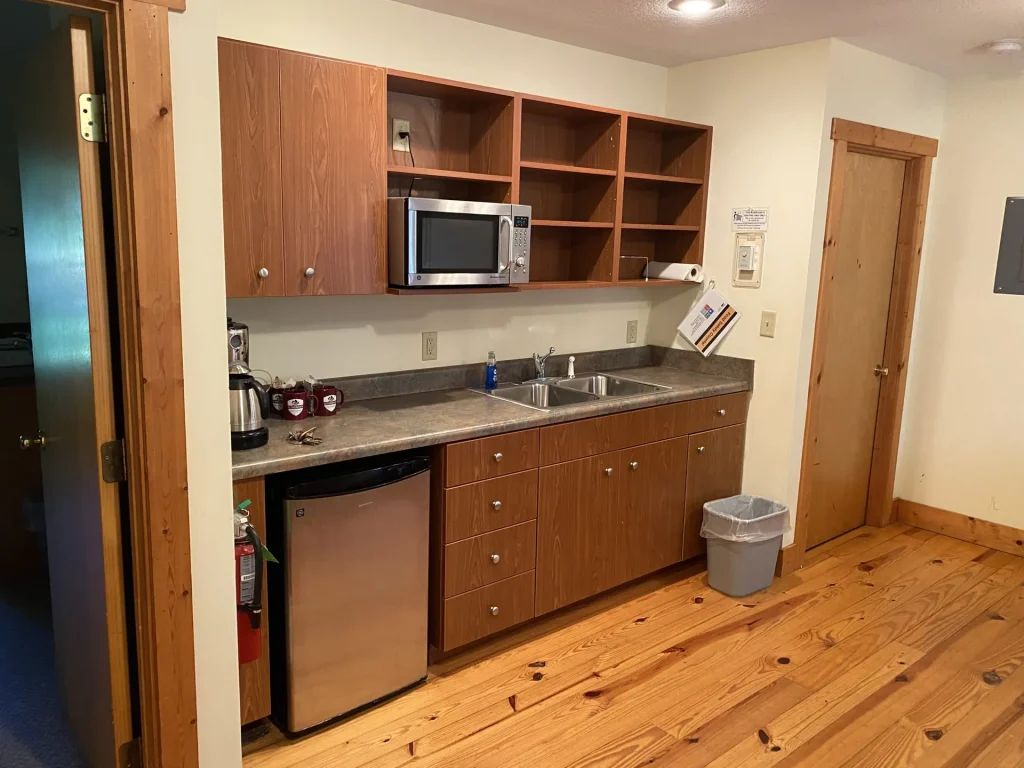 The kitchenette in a Lakeside Village cabin: sink, microwave and small refrigerator