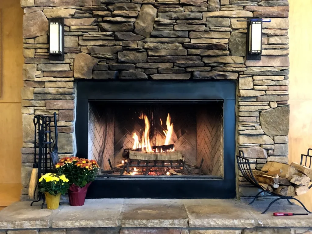 The Crow's Nest stone fireplace, a fire lit
