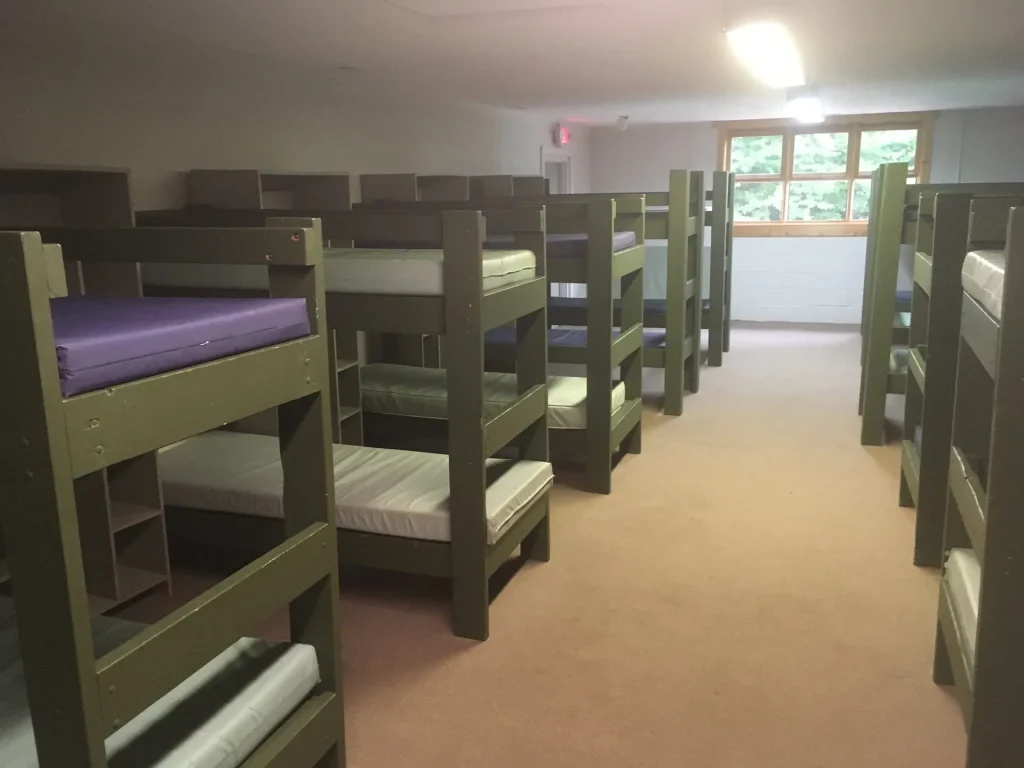 A Founders Lodge bunk room with rows of bunk beds