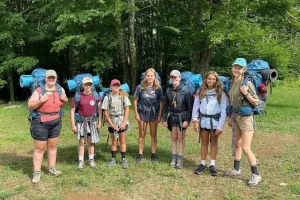A Whitewater Backpack group of campers with their packs on, ready to set out from Lutherock